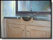 photo d'un meuble de salle de 
bain avec lavabo en cuivre 